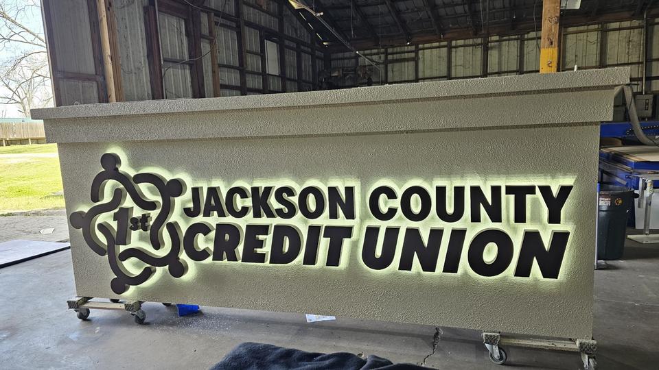 Jackson County Credit Union halo-lit letters in the Coastal shop